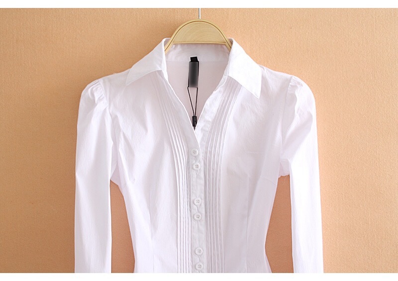 White bodysuit with long sleeves on a beige background
