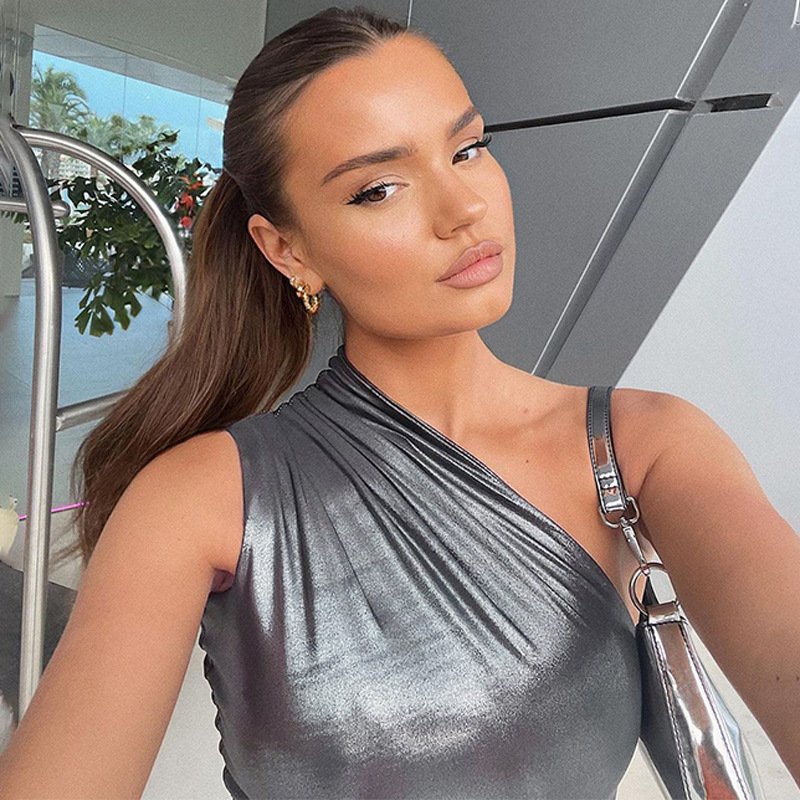 Silver metallic dress worn by a person indoors.