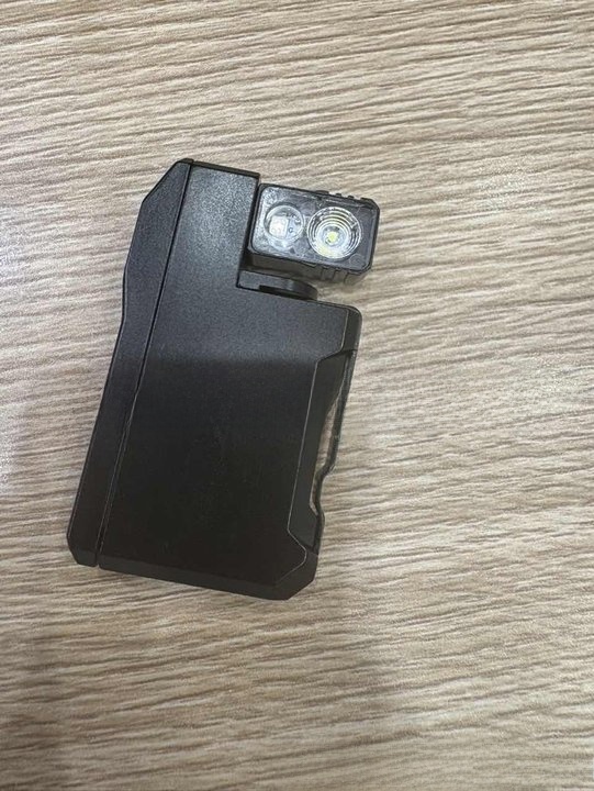 Flashlight magnetic base in use