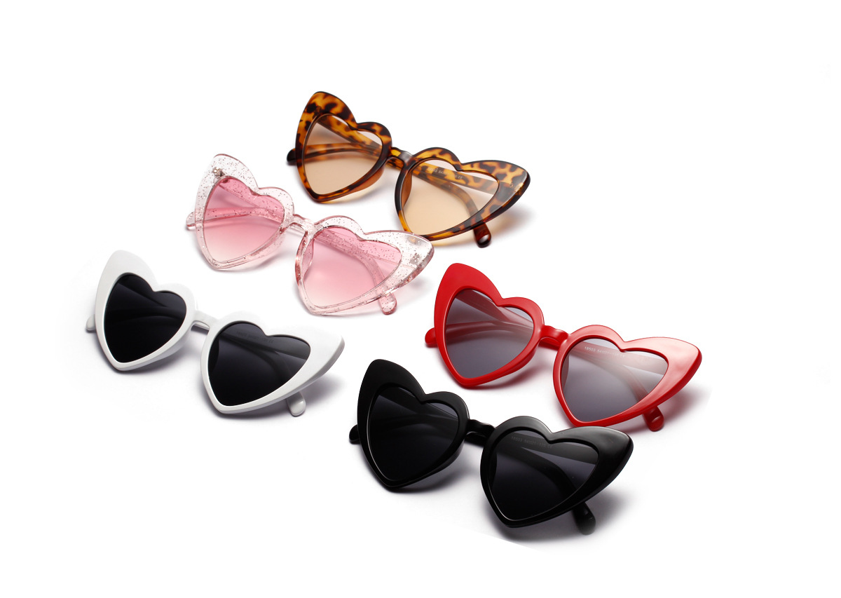 Heart sunglasses on face