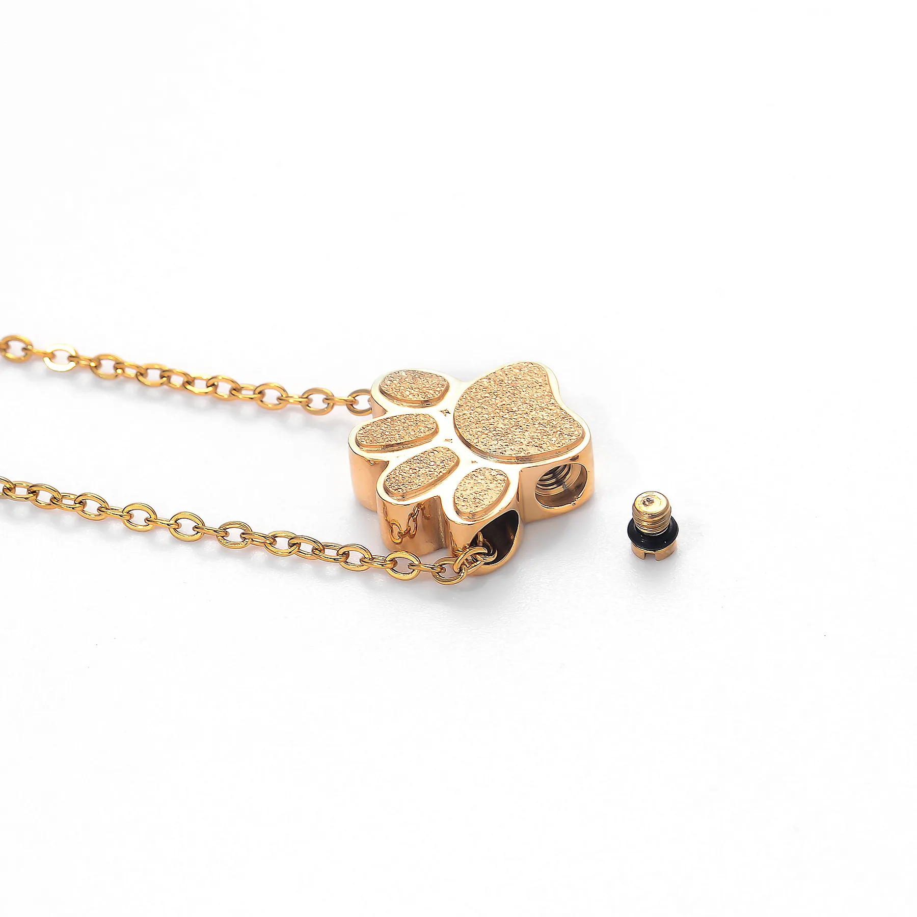 PawKeep™ paw pendant with the keepsake compartment open