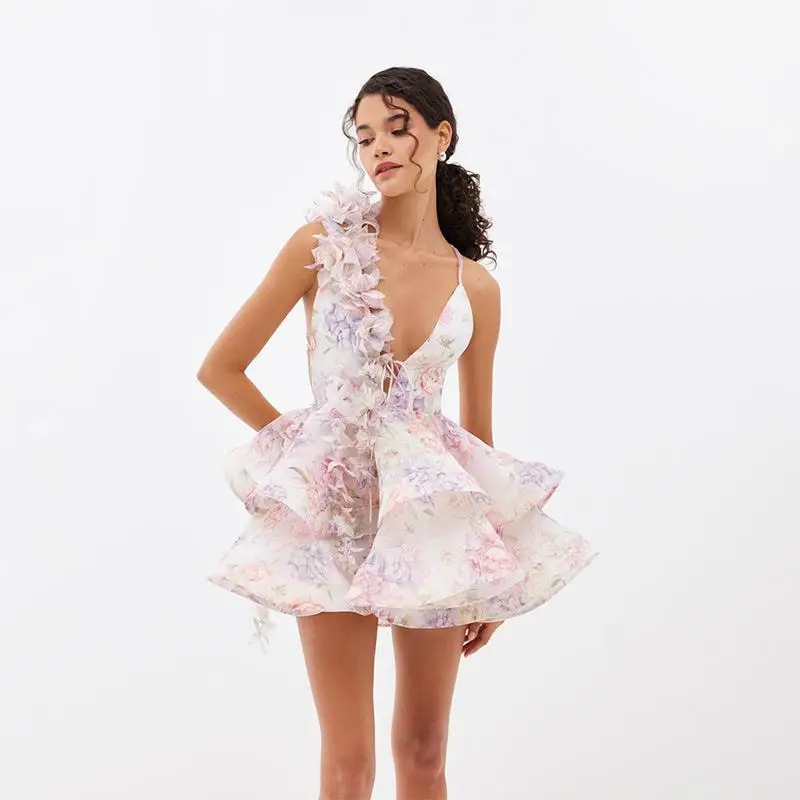 women dressed in a floral dress with grey in the background fashionvelvet