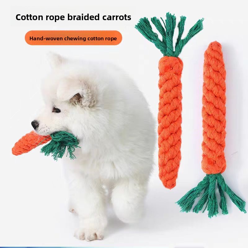 Dog playing with cotton rope carrot chew toy puppy large breed