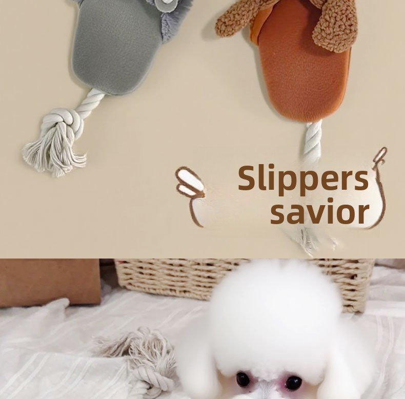 Dog playing with plush squeaker puppy slipper toy