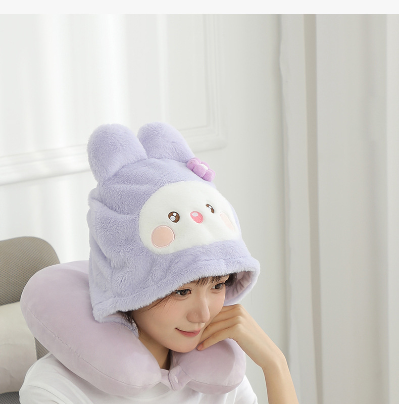 Person wearing the lavender rabbit hooded U-shaped pillow