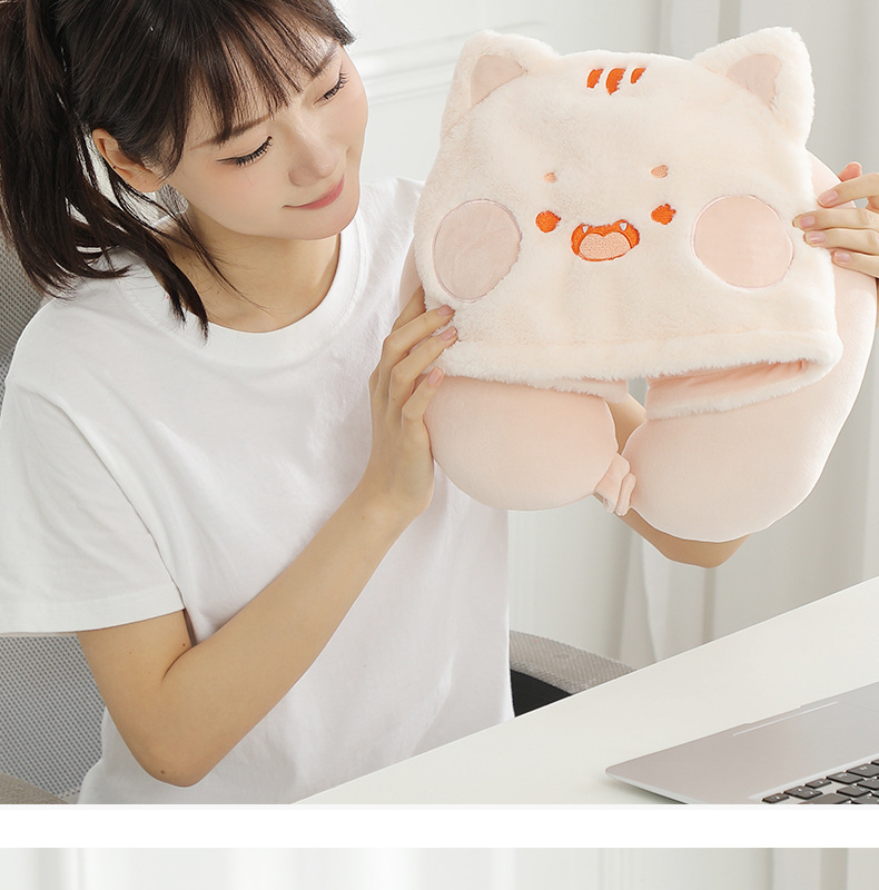 Person holding the pink kitten hooded pillow