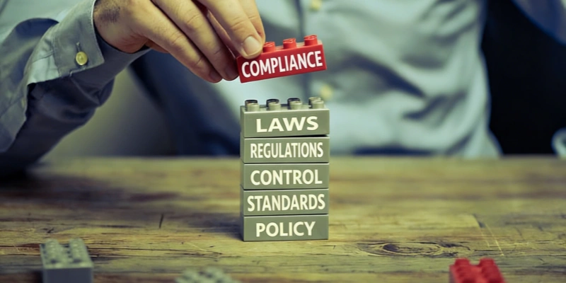 Hand placing compliance block on regulatory tower