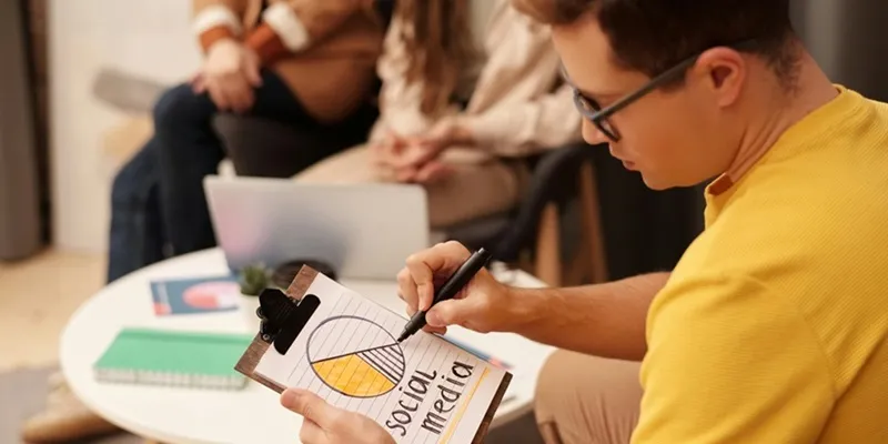 A man is studying the percentage of social media traffic on his website