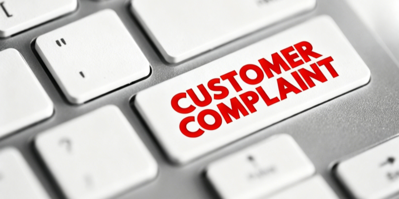 E-commerce customer complaint red text computer keyboard key