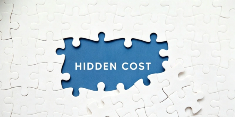 Hidden cost uncovered white puzzle pieces