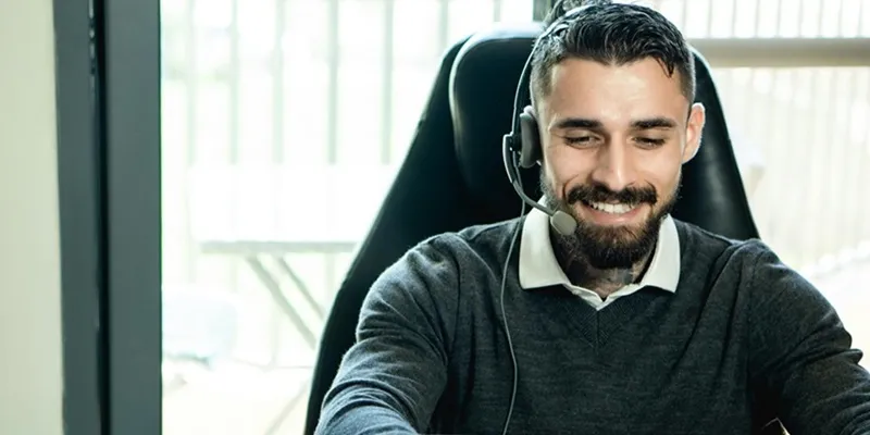 A smiling male customer service professional