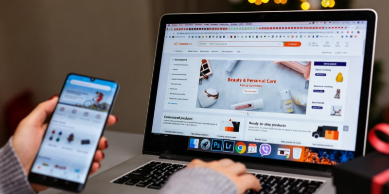 Aliexpress product sourcing on laptop and mobile for dropshipping business