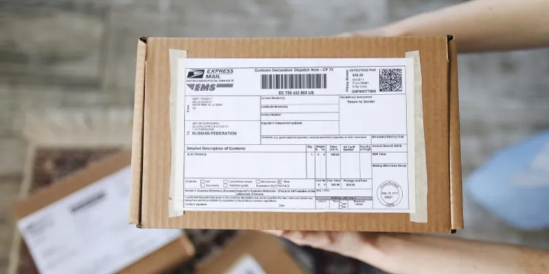 A person holding a parcel box with both hands